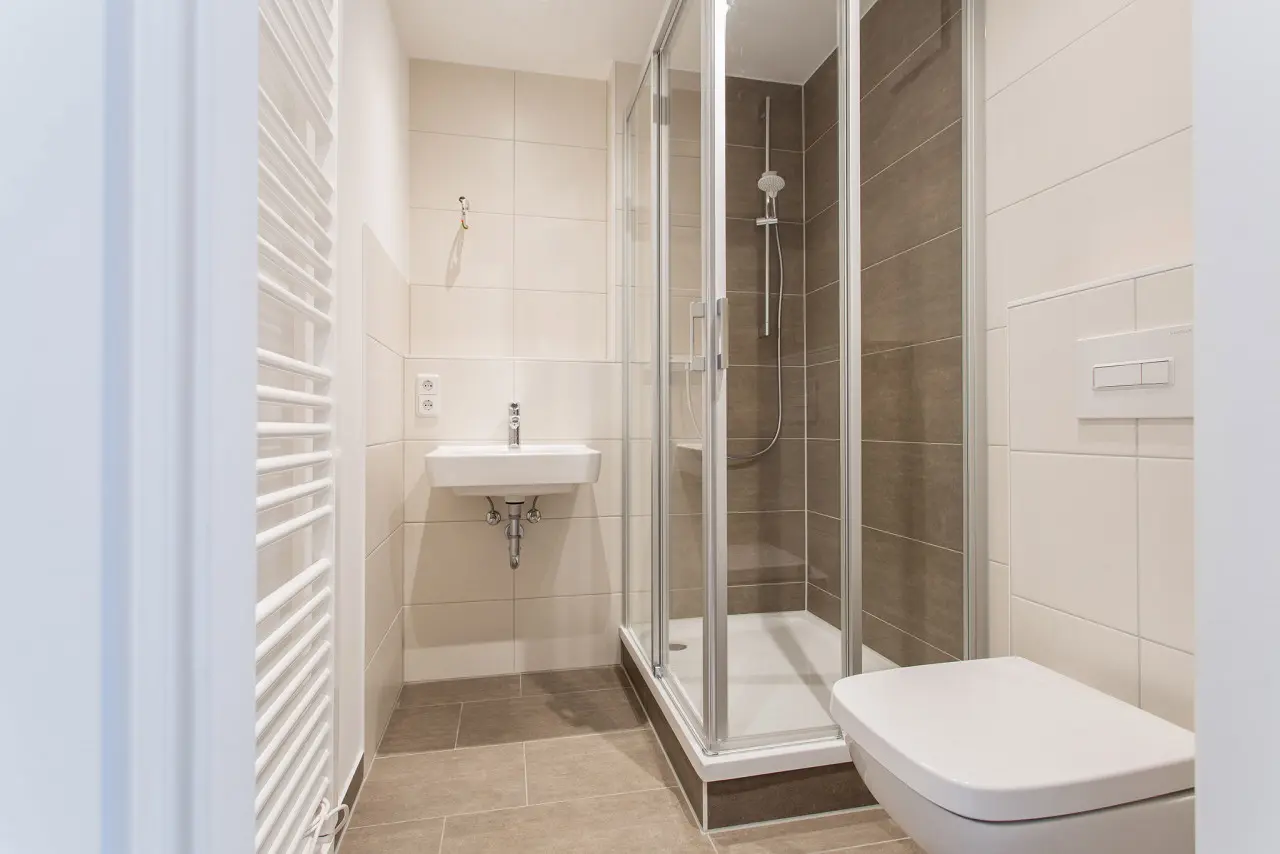 Comparison Photo: Bathroom with Shower - 2 Rooms with Elevator in a Green Setting